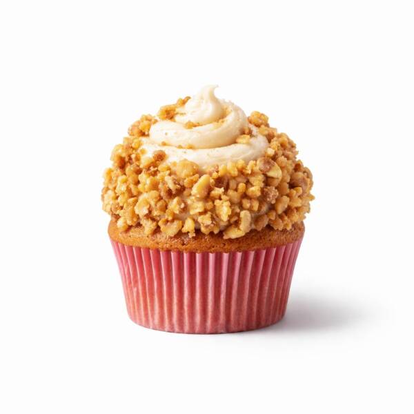 Carrot cake cupcake topped with brown butter cream cheese frosting and toasted walnut crumble on a light background